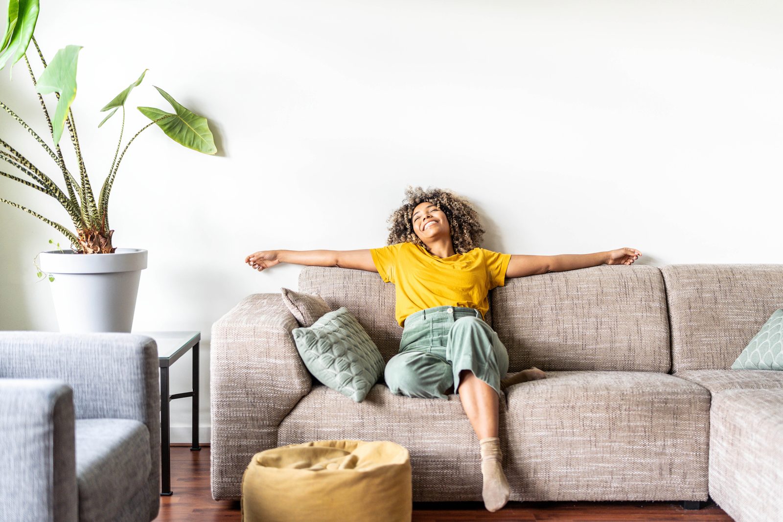 A resident relaxing at home in a calm, comfortable living space
