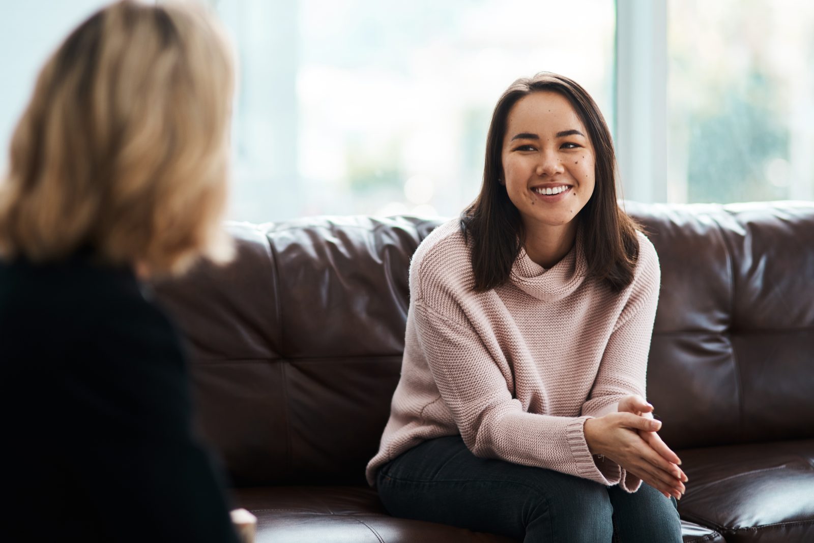 A resident in a warm, supportive one-on-one conversation